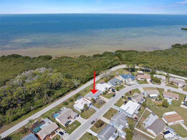 birds eye view of property with a water view and a residential view