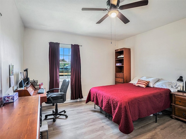 bedroom featuring ceiling fan and wood finished floors