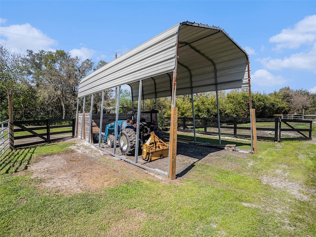 exterior space featuring fence and a detached carport