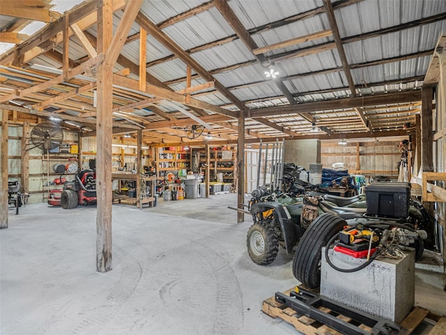 garage featuring a workshop area and metal wall