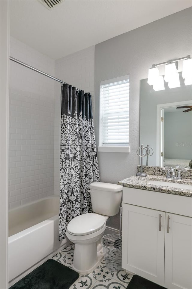 full bath with shower / bath combo, visible vents, toilet, tile patterned floors, and vanity