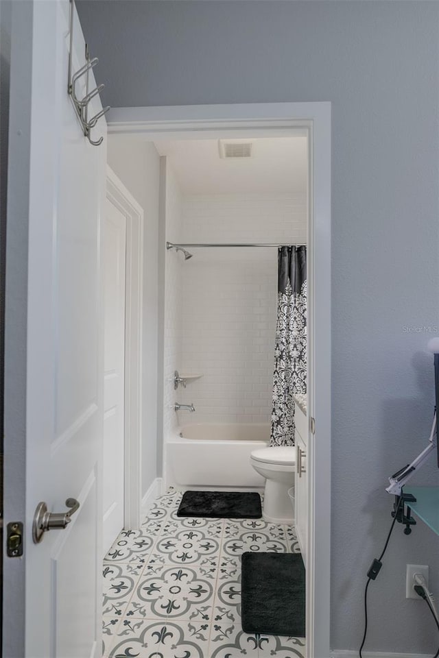 full bathroom with toilet, shower / bath combo, visible vents, and tile patterned floors