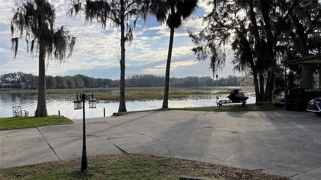 view of patio with a water view