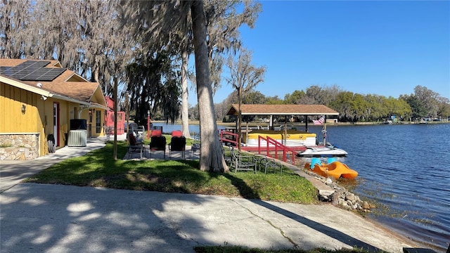 view of community with a water view