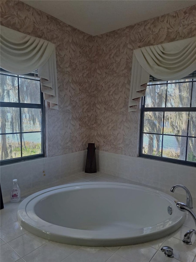 full bathroom with a garden tub and wallpapered walls