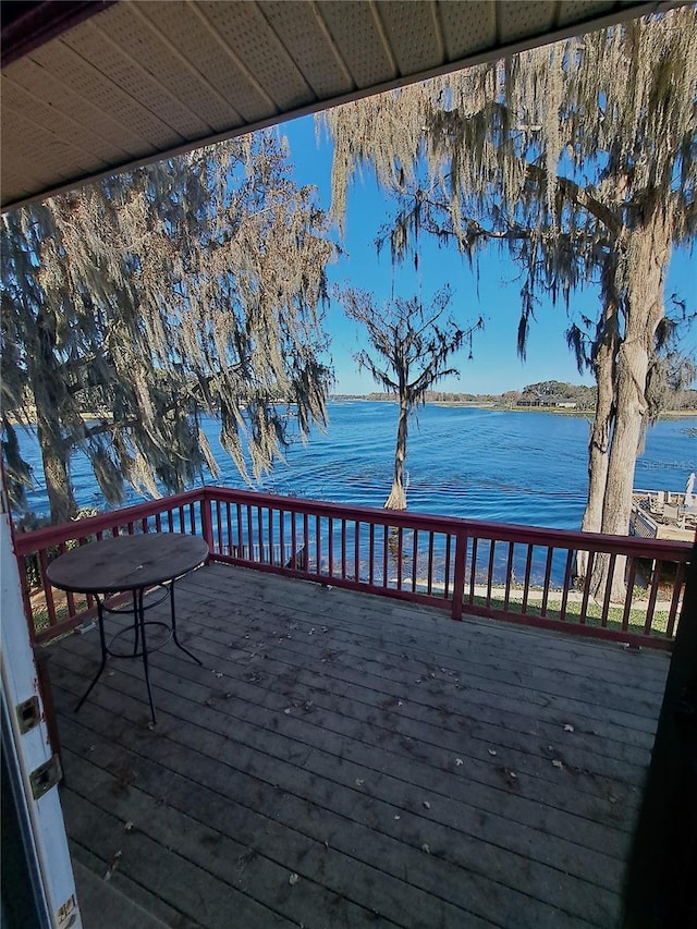 wooden deck with a water view