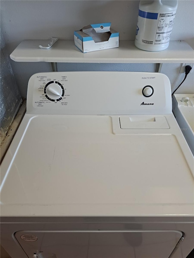 laundry area featuring laundry area and washer / clothes dryer