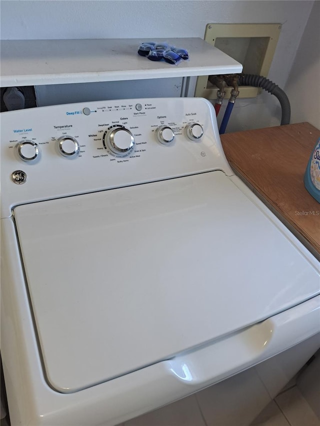 laundry room with washer / dryer and laundry area