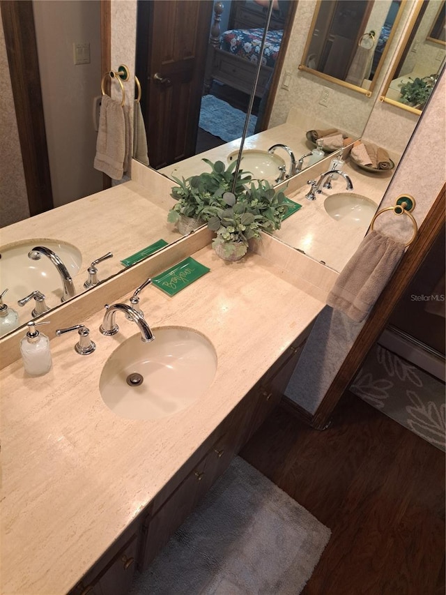 bathroom featuring wood finished floors and vanity