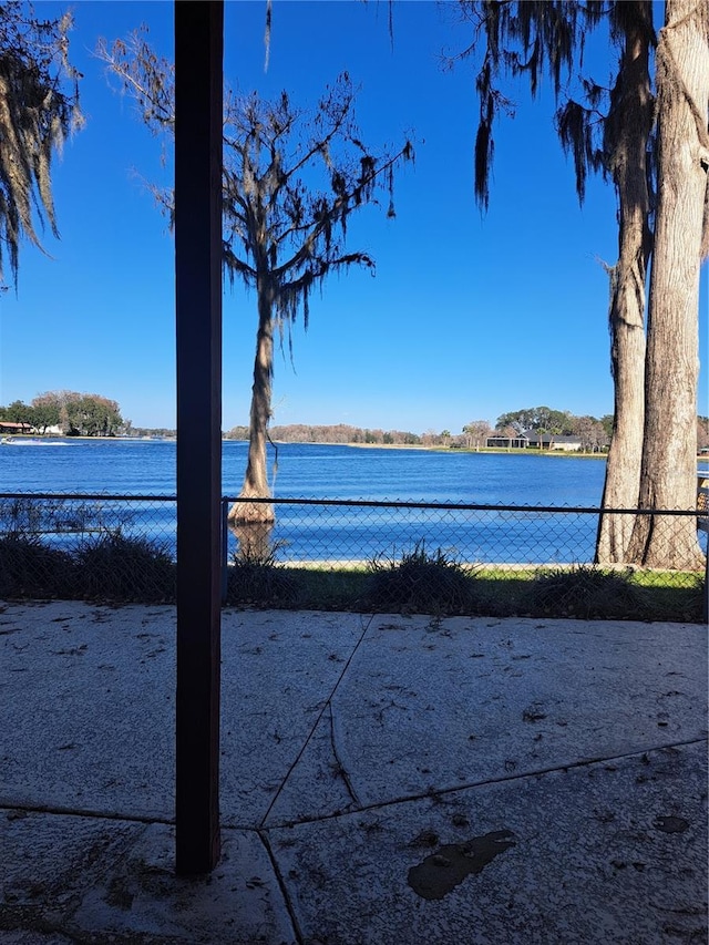 view of water feature with fence