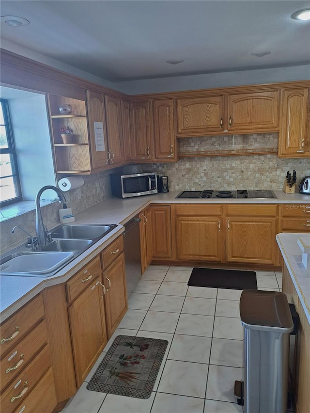 kitchen featuring dishwashing machine, stovetop with downdraft, a sink, open shelves, and stainless steel microwave