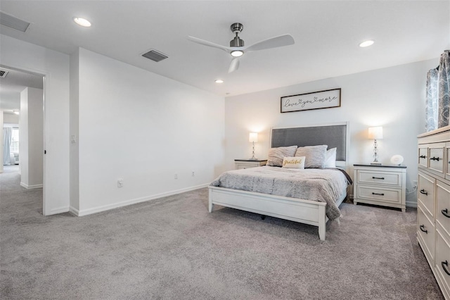 bedroom with recessed lighting, light colored carpet, visible vents, and baseboards