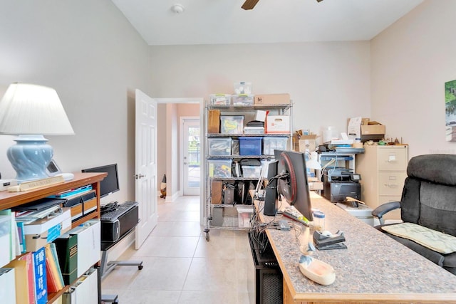 office space featuring ceiling fan and light tile patterned floors