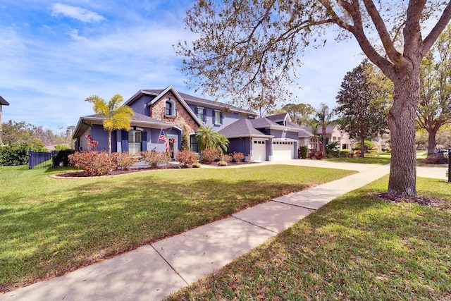 view of front of home featuring a garage, stone siding, a front lawn, and concrete driveway