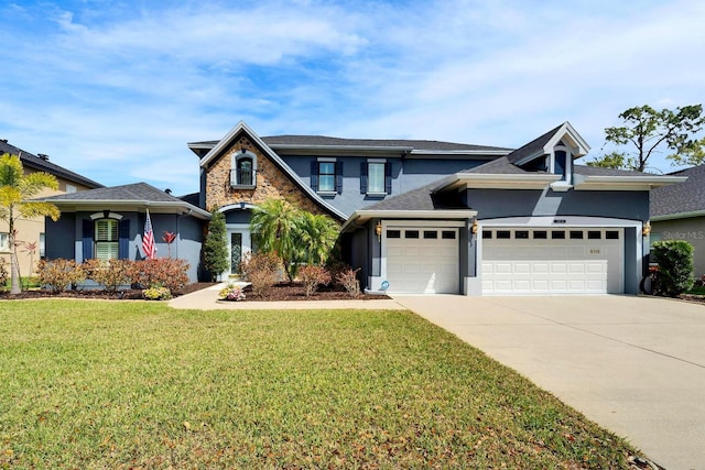 traditional-style home featuring a garage, driveway, stone siding, stucco siding, and a front lawn