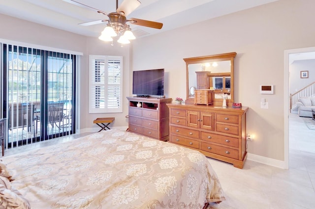 tiled bedroom featuring access to exterior, baseboards, and a ceiling fan