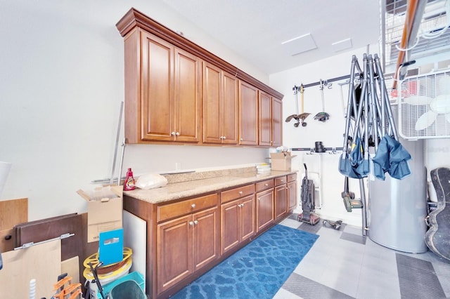 interior space with light countertops, dark floors, and brown cabinetry