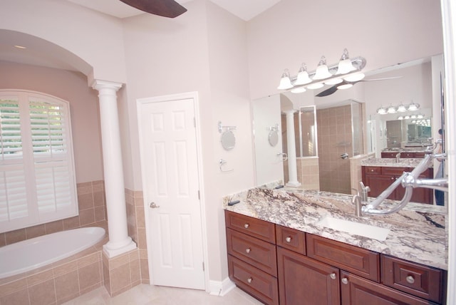 5115 Abisher Wood Ln, Brandon, FL 33511 - bathroom with decorative columns, a garden tub, ceiling fan, vanity, and a tile shower