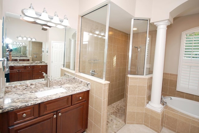 5115 Abisher Wood Ln, Brandon, FL 33511 - bathroom with decorative columns, walk in shower, a bath, and vanity
