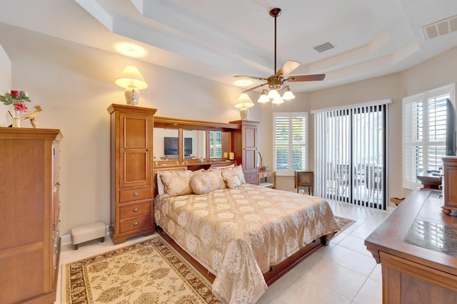 5115 Abisher Wood Ln, Brandon, FL 33511 - bedroom with a tray ceiling, light tile patterned flooring, access to exterior, and ceiling fan