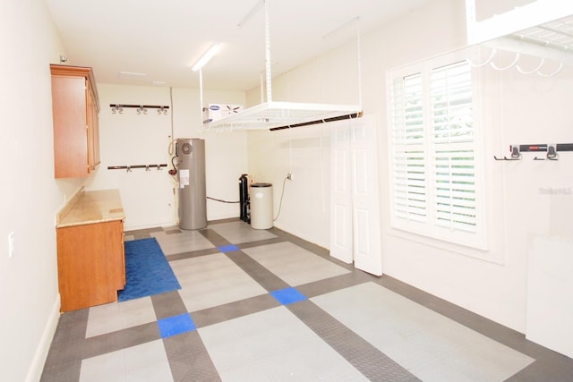 5115 Abisher Wood Ln, Brandon, FL 33511 - garage featuring water heater and baseboards