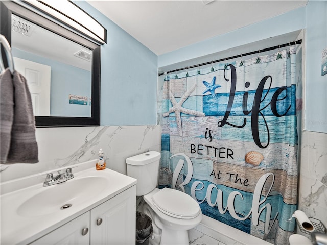 bathroom with marble finish floor, tile walls, visible vents, toilet, and vanity