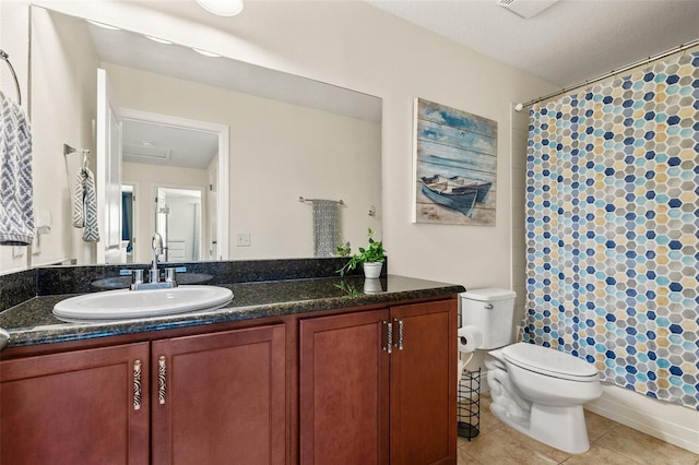 bathroom with a shower with curtain, tile patterned flooring, vanity, and toilet