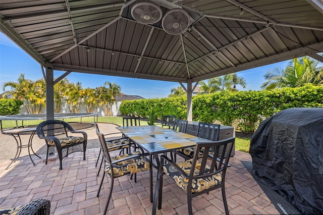 view of patio / terrace with a gazebo, grilling area, and outdoor dining space