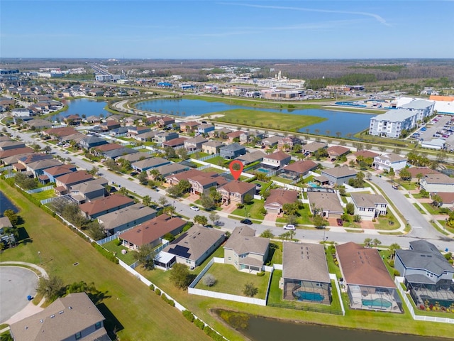 aerial view with a water view and a residential view