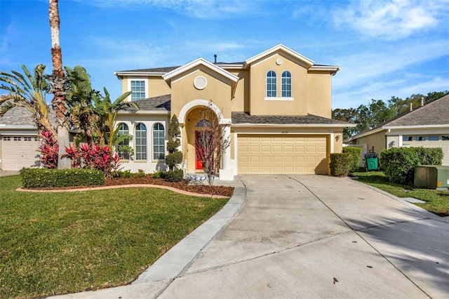 view of front of property featuring stucco siding, concrete driveway, a garage, and a front yard