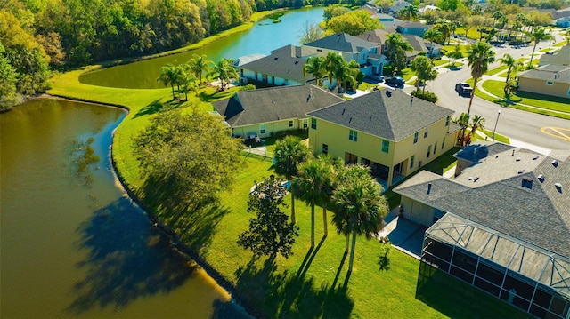 bird's eye view with a residential view and a water view