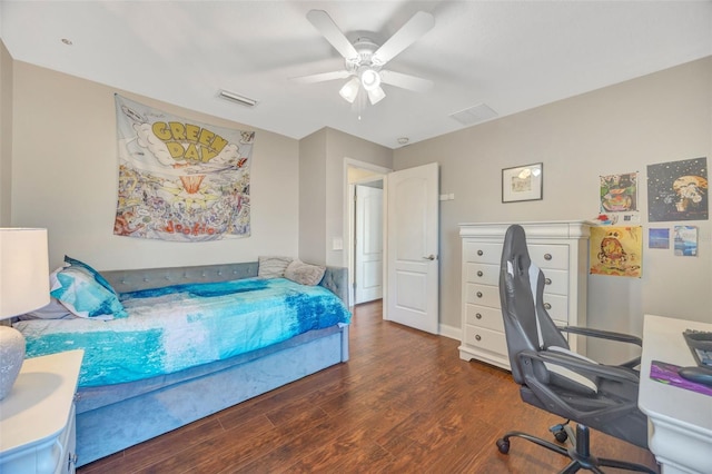 bedroom featuring visible vents, ceiling fan, and wood finished floors