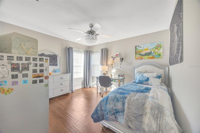 bedroom featuring hardwood / wood-style flooring, baseboards, and ceiling fan