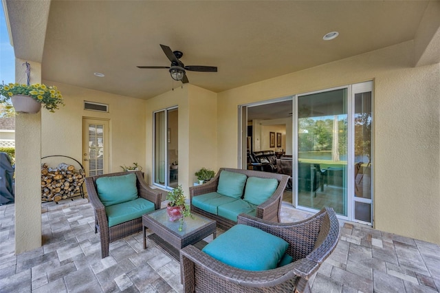 view of patio / terrace featuring visible vents, an outdoor living space, and ceiling fan