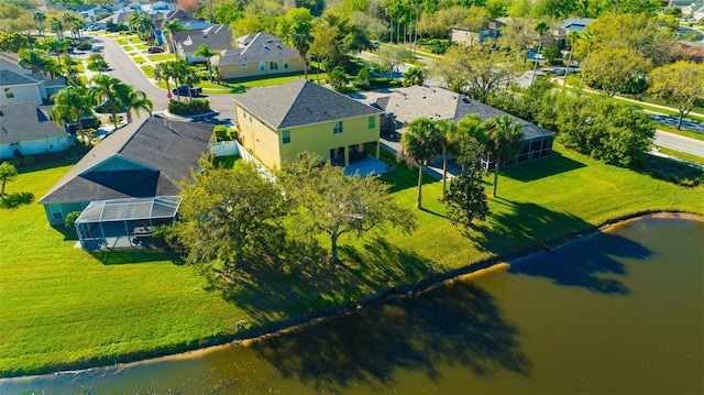 bird's eye view with a residential view and a water view