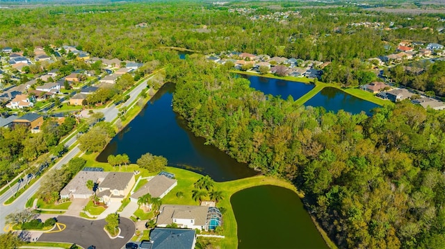 drone / aerial view with a residential view and a water view