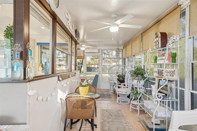 sunroom / solarium featuring ceiling fan and a wall unit AC