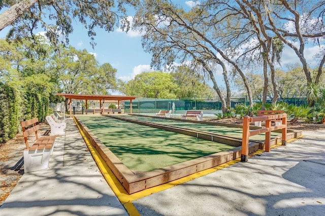 view of community featuring fence