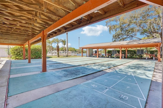 view of home's community featuring shuffleboard