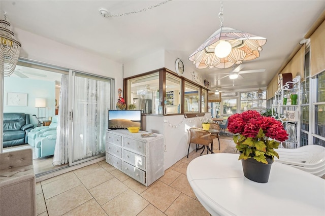 interior space featuring ceiling fan and tile patterned floors