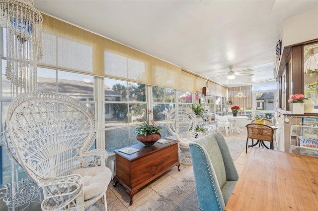 sunroom featuring a ceiling fan