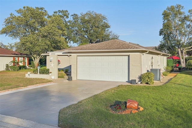 ranch-style home with brick siding, central air condition unit, concrete driveway, a garage, and a front lawn