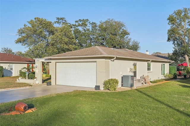 view of side of home featuring an attached garage, brick siding, central AC unit, and a yard