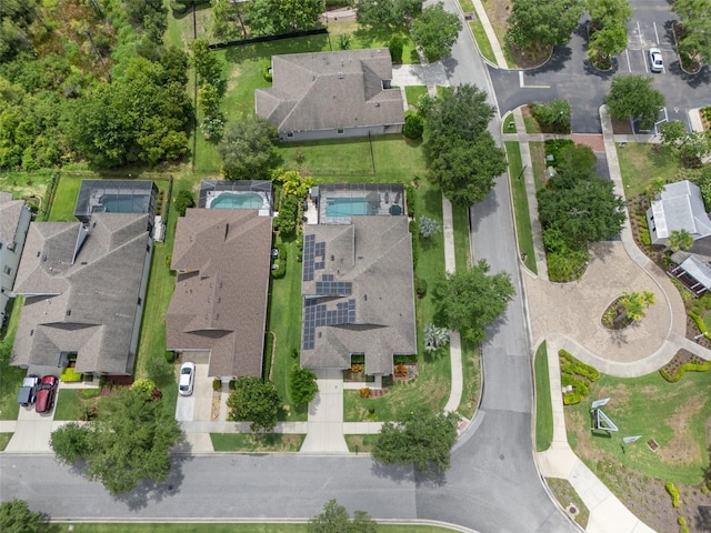 birds eye view of property with a residential view