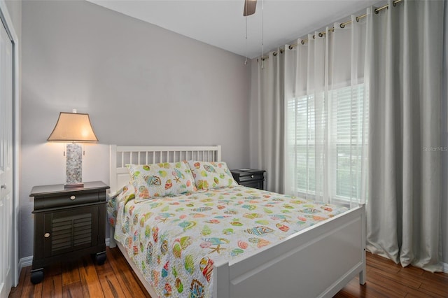 bedroom with wood-type flooring and a ceiling fan