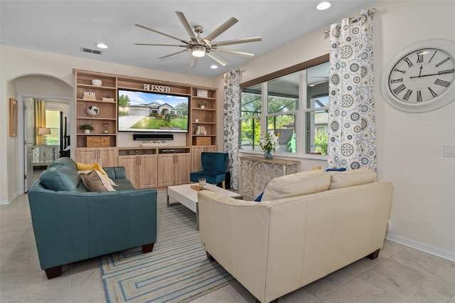 living area featuring a ceiling fan, recessed lighting, visible vents, and baseboards