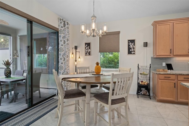 dining space featuring a chandelier