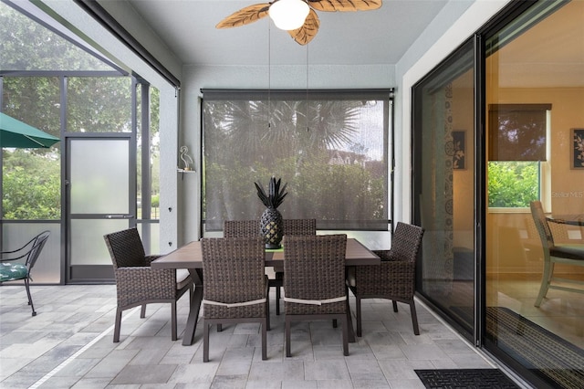 sunroom featuring plenty of natural light and ceiling fan