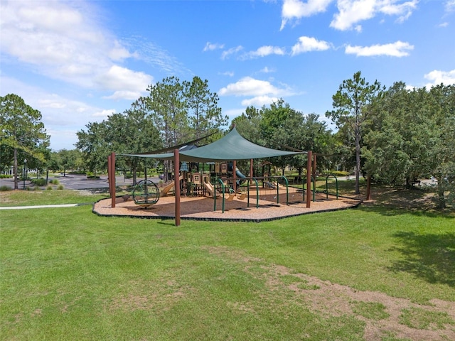 community jungle gym featuring a lawn