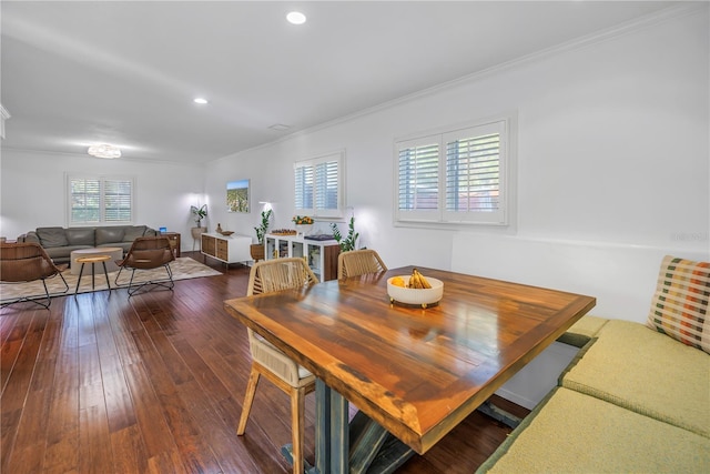 dining room featuring dark wood-type flooring, recessed lighting, and ornamental molding